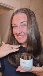 Woman applying Vinchella ThermoGlow Mask ProPeptidic thermal face mask with warming effect for smoother, firmer-looking skin.